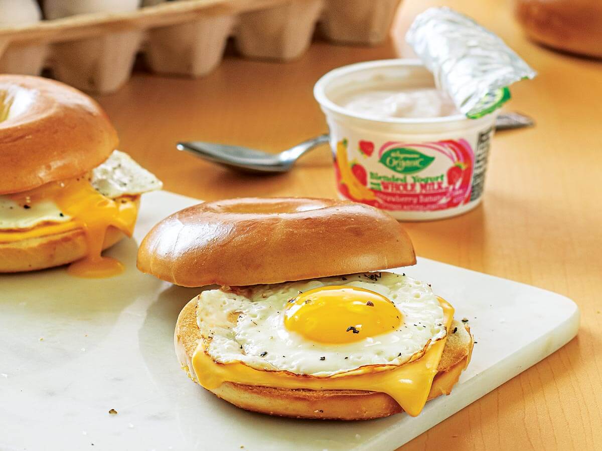 back to school breakfast idea - egg and cheese on a bagel with a side of yogurt