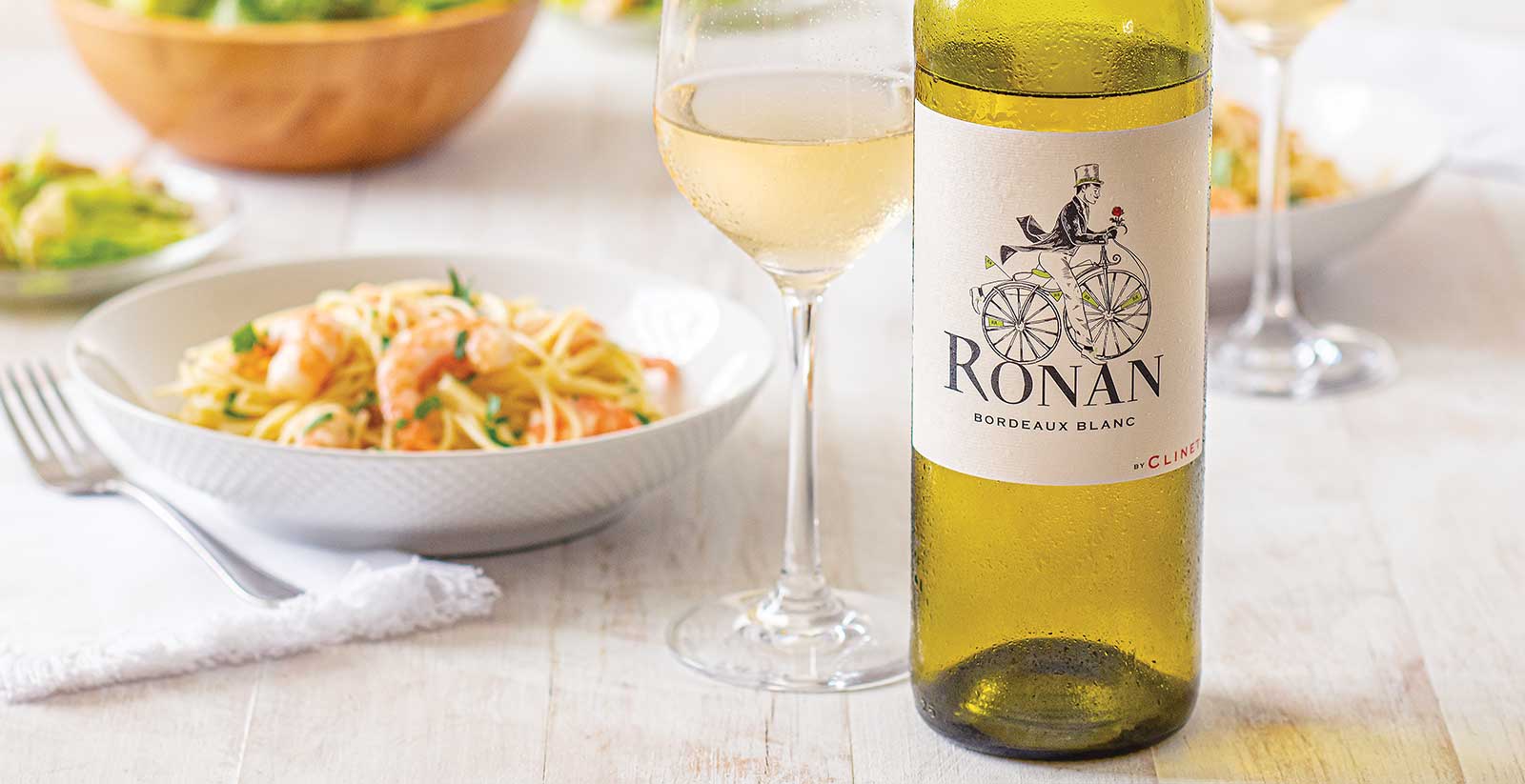 Ronan by Clinet White Bordeaux paired with Shrimp Scampi over angel hair pasta paired with Amore Caesar Salad